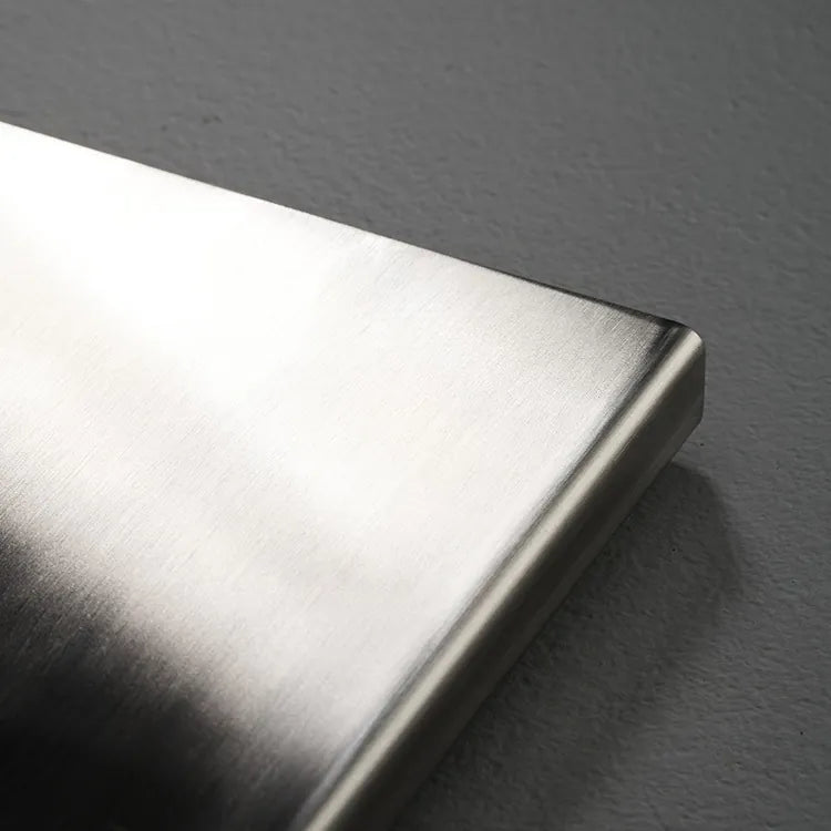 Metallic object on a gray background