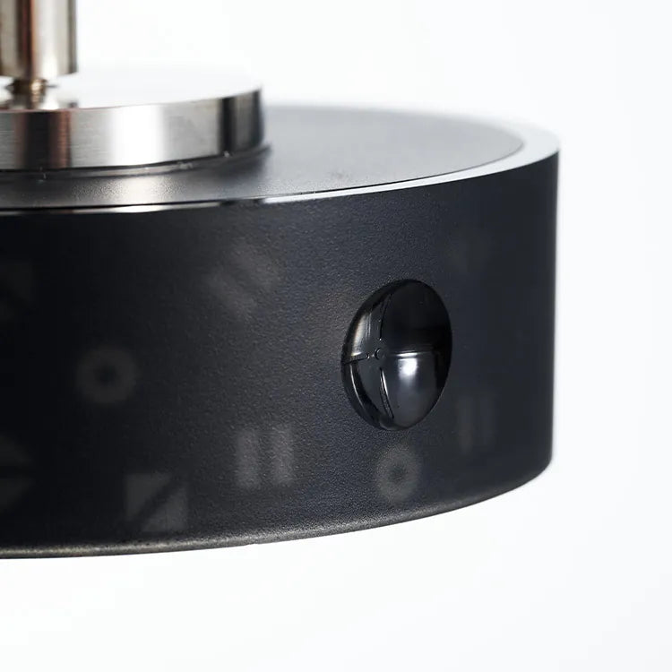 Close-up of a black and silver kitchen tool on a white background