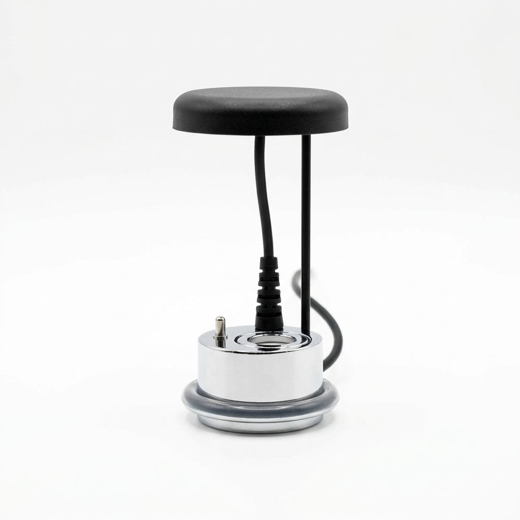 SOS Lumina Mist Maker, small device with a black top and silver base on a white background