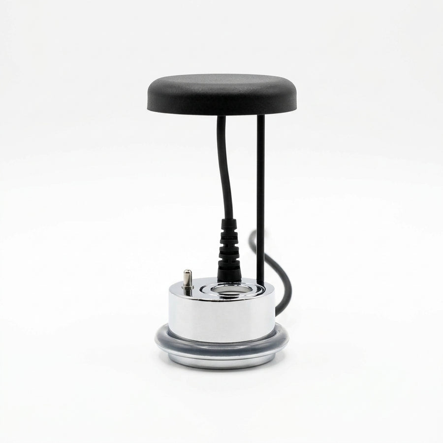 Small electronic device with a black top and silver base on a white background