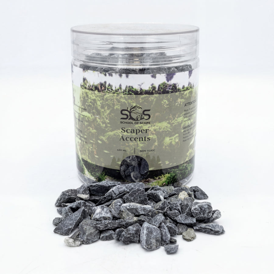 Jar of Scaper Accents with decorative stones on a white background