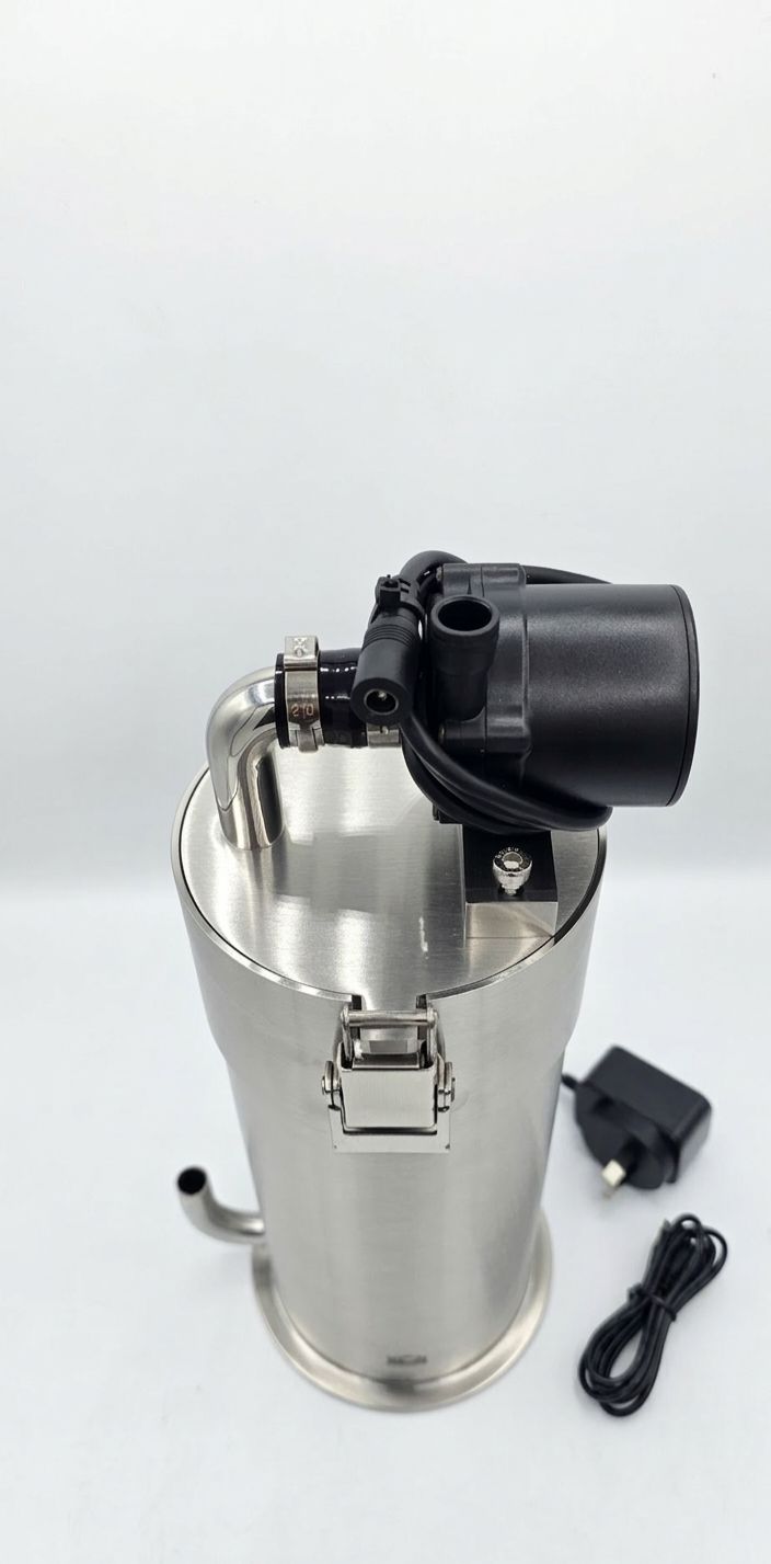 Stainless steel water filter with black top and power adapter on a white background